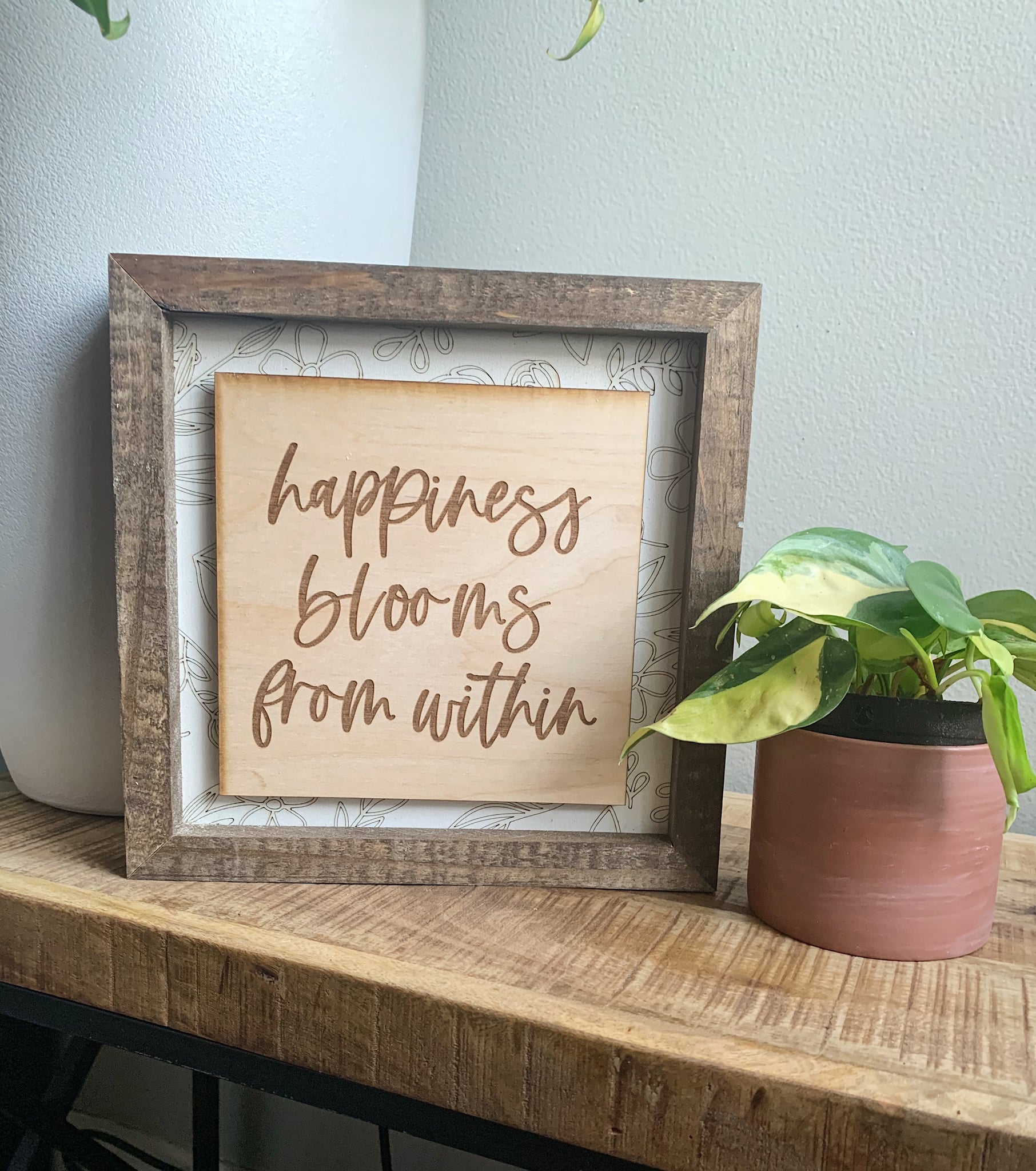 Happiness Blooms Within Layered Sign